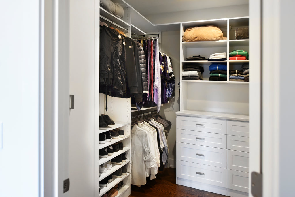 Double hutch gives small walk-in closet a built-in furniture look