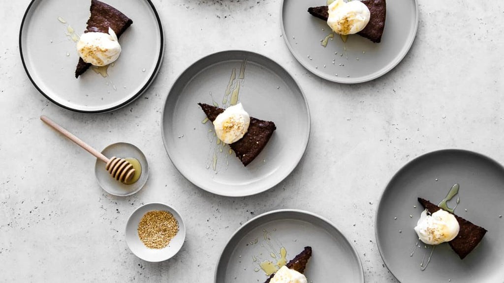 Decadent and chocolatey, with hints of honey and toasted sesame, our Tahini and Chocolate Flourless Cake with Honey Whipped Cream is a simple and elegant gluten-free cake to celebrate any occasion or just-because moments.